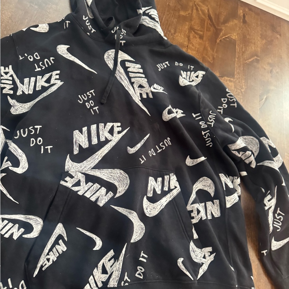 Nike Black Hoodie with White Logo Patterns
